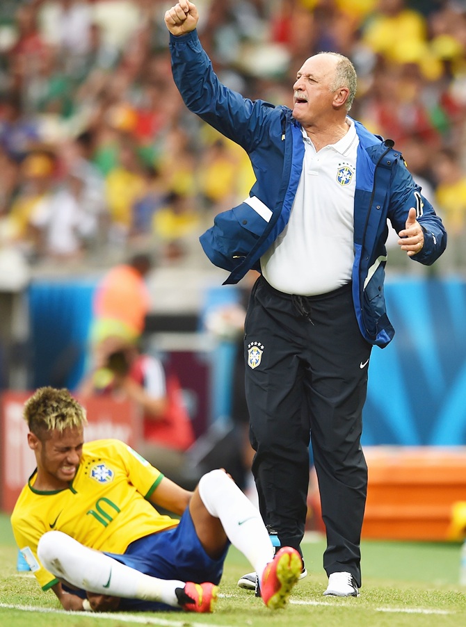 Head coach Luiz Felipe Scolari of Brazil reacts as Neymar sits on the field