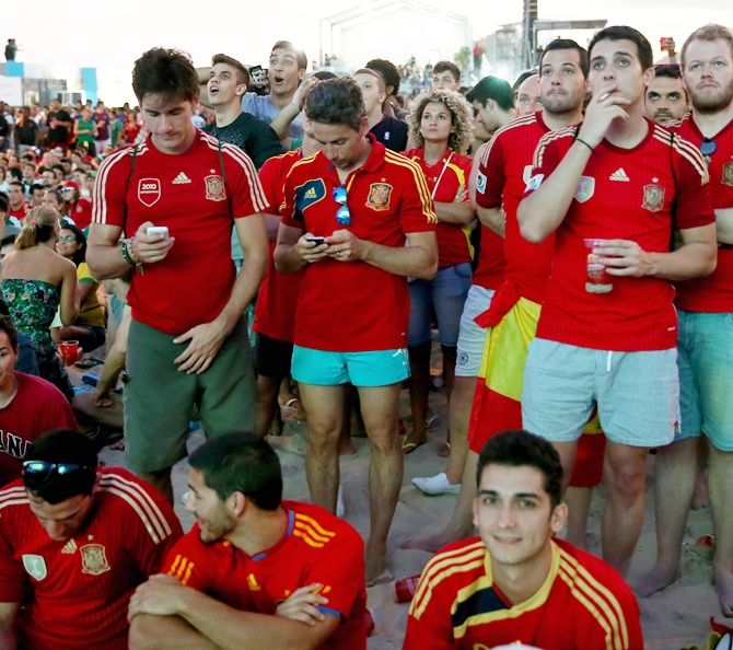Fans of the Spanish team watch