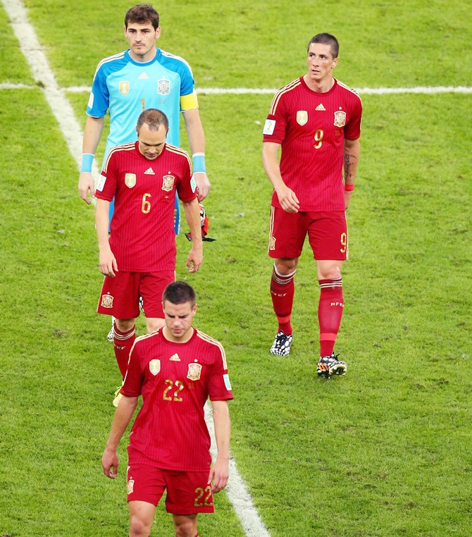 Cesar Azpilicueta, Andres Iniesta,Iker Casillas and Fernando Torres of Spain walk off the pitch after a 2-0 defeat to Chile