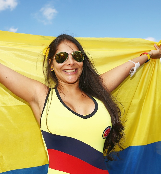 A Colombia fan holds a flag prior to the 2014 FIFA World Cup Brazil Group C match against Ivory Coast