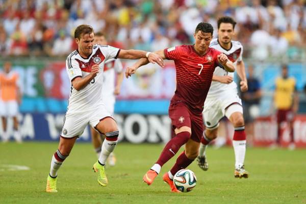 Cristiano Ronaldo breaks away from two German defenders during the World Cup Group G match
