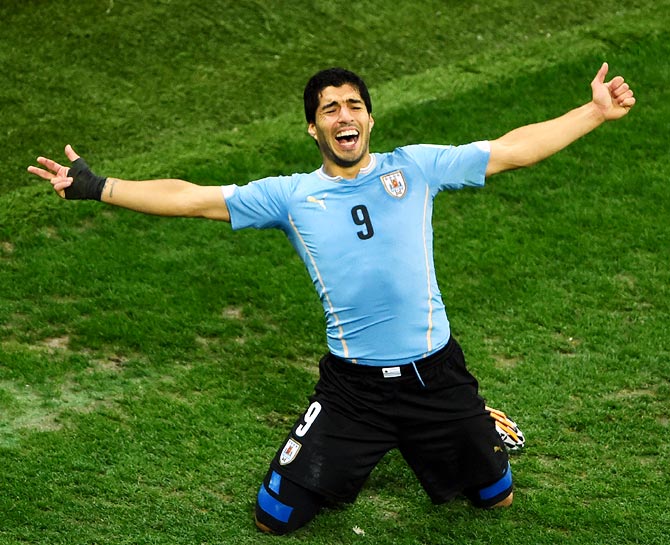 Luis Suarez of Uruguay celebrates after scoring the second goal against England.