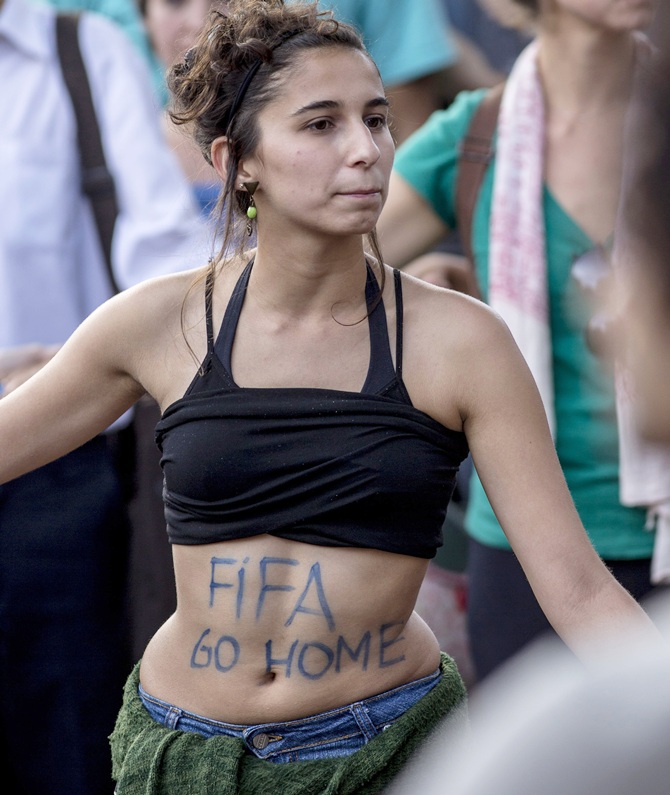 A protester participates in a demonstration against the 2014 World Cup