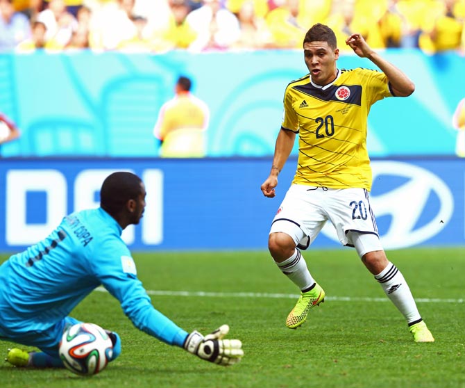 Juan Quintero of Colombia scores his team's second goal past Ivory Coast goalkeeper Boubacar Barry