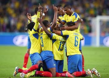 Enner Valencia (No 13) of Ecuador celebrates with teammates after scoring his team's second goal against Honduras