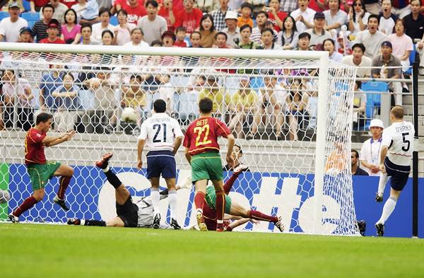 John O'Brien of the United States (far right) scores the opening goal against Portugal during the first half of the Group D, World Cup Group Stage match at the Suwon World Cup Stadium, Suwon, South Korea on June 5, 2002. 