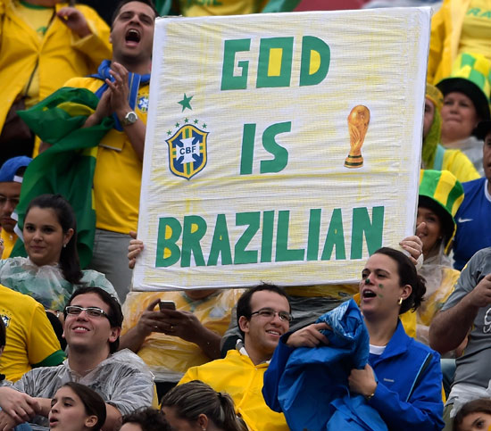 Brazilian fans cheer their team