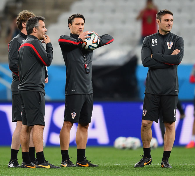 Croatia coach Niko Kovac with the team's assistant coach Robert Kovac (right) at a training session