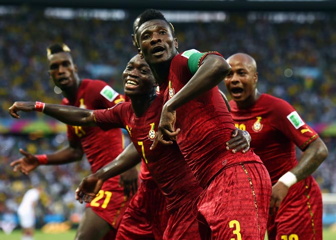 Asamoah Gyan (front) celebrates scoring Ghana's second goal with team mates