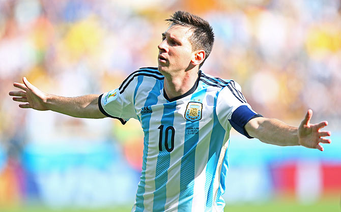 Lionel Messi of Argentina celebrates scoring his team's first goal against Iran on Saturday