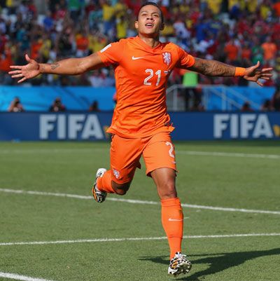 Memphis Depay of the Netherlands celebrates scoring his team's second goal against Chile