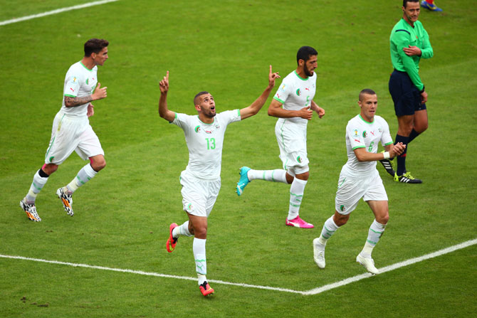 Islam Slimani of Algeria celebrates scoring his team's first goal during the Group H against South Korea