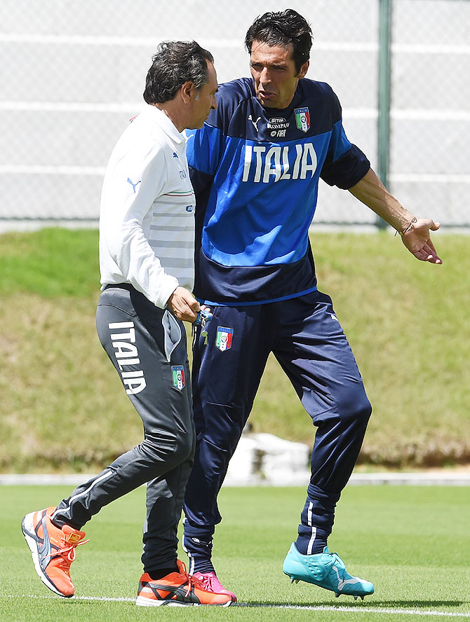 Head coach Italy Cesare Prandelli (left) and Gianluigi Buffon are involved in an animated discussion during their training session in Natal on Sunday
