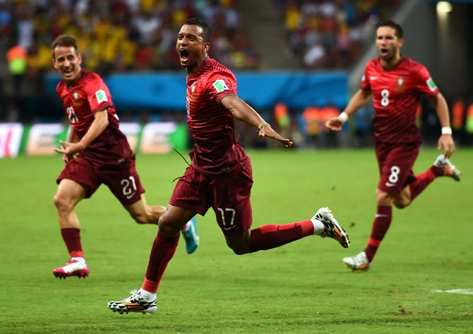 Nani of Portugal (centre) celebrates scoring his team's first goal against USA