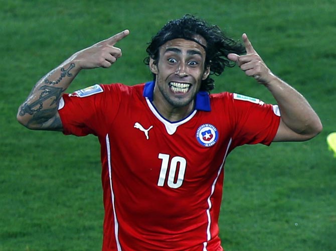 Chile's Jorge Valdivia celebrates scoring against Australia.