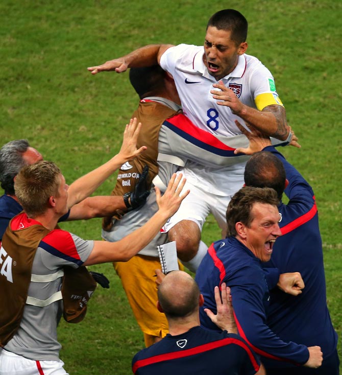 Clint Dempsey of the United States celebrates with teammates after scoring his team's second goal against Portugal.
