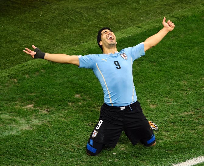 Luis Suarez of Uruguay celebrates after scoring his team's second goal against England