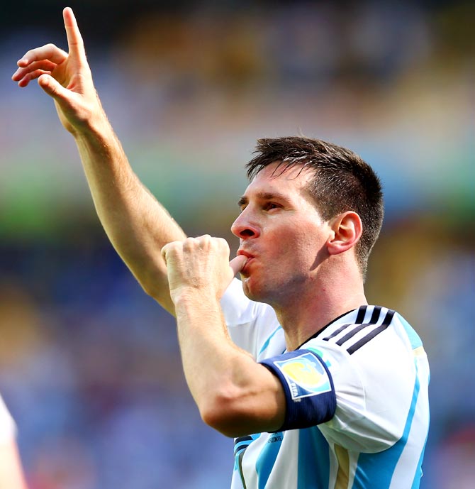 Lionel Messi of Argentina celebrates after scoring a goal against Iran.