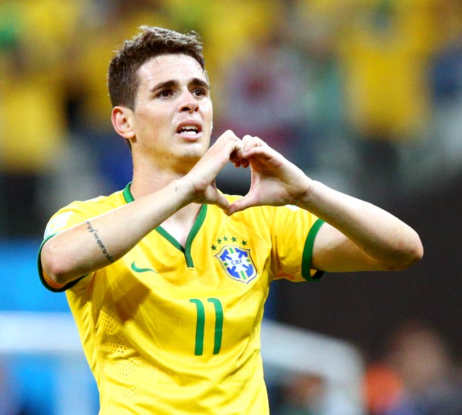 Oscar of Brazil celebrates his goal in the second half against Croatia