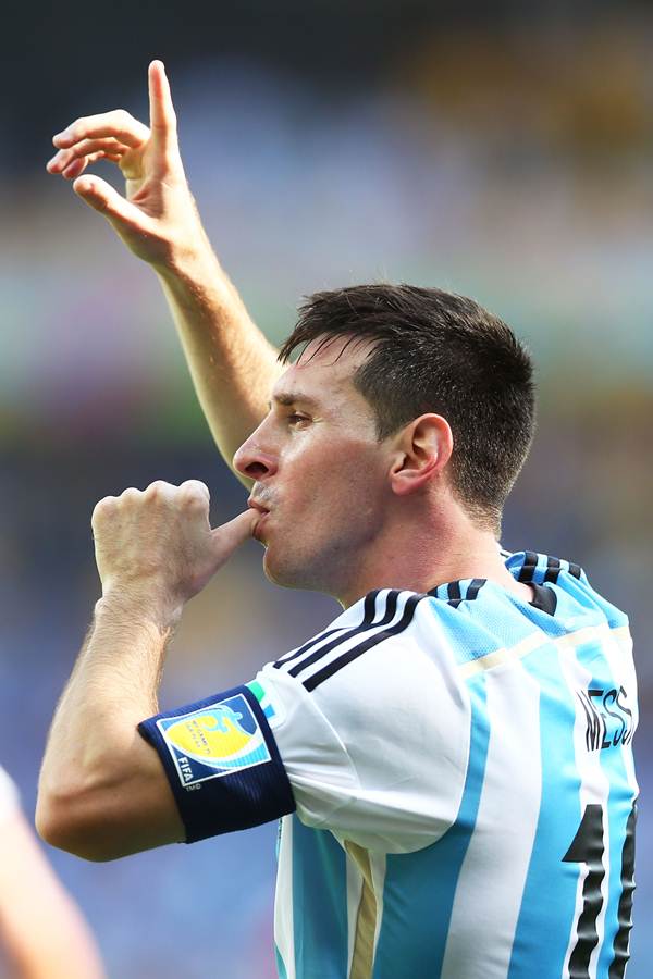 Lionel Messi celebrates scoring Argentina's goal against Iran