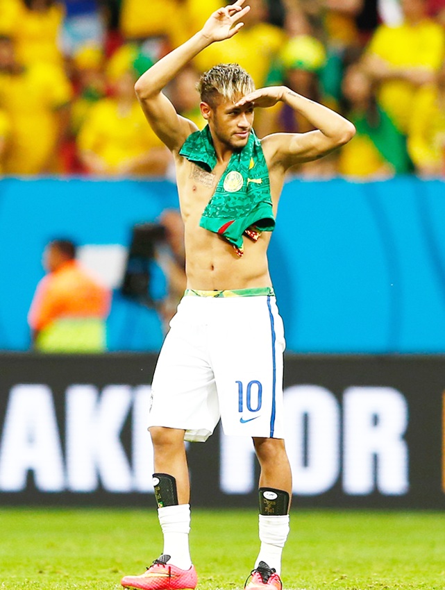 Neymar of Brazil acknowledges the fans after defeating Cameroon 4-1