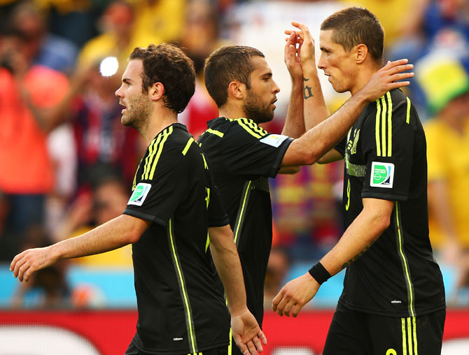 Fernando Torres of Spain (right) celebrates scoring his team's second goal with teammates