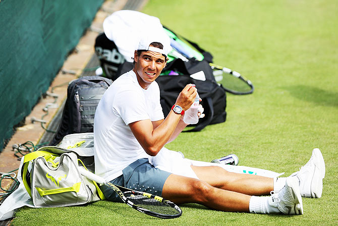 Rafael Nadal of Spain takes a break during a practice session on day one of the Wimbledon Lawn Tennis Championships at the All England Lawn Tennis and Croquet Club at Wimbledon on Monday