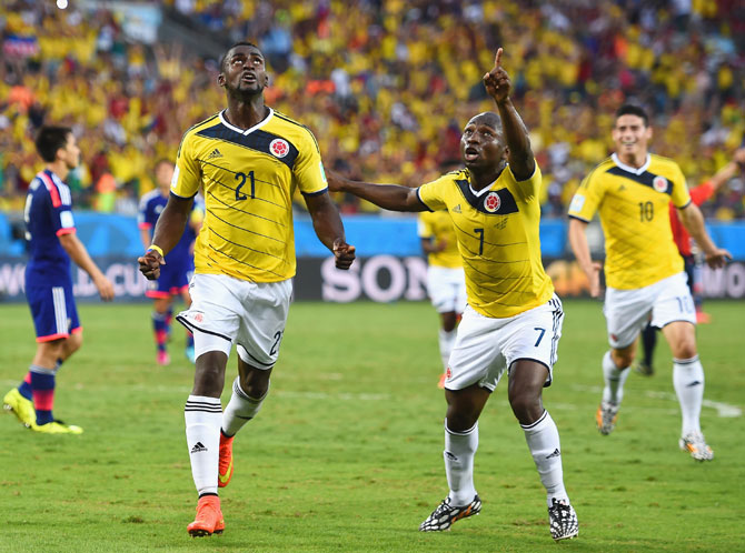 Jackson Martinez of Colombia (left) celebrates scoring his team's second goal