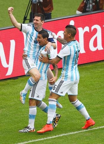 Lionel Messi (left) celebrates with teammates Angel di Maria (centre) and Marcos Rojo after scoring Argentina’s first goal against Nigeria.