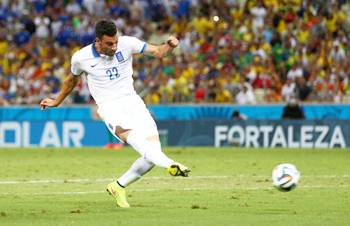 Andreas Samaris opens the scoring for Greece against Ivory Coast