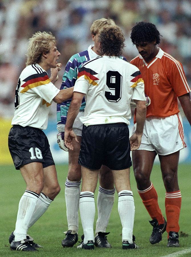 Jurgen Klinsmann (left) and Rudi Voller (centre) both of West Germany and Frank Rijkaard (right) of Holland in discussion with the referee 