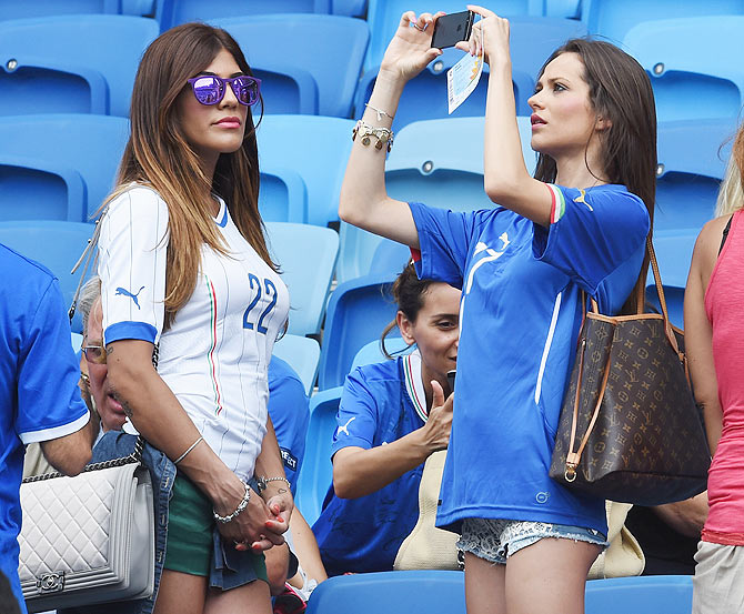 Jenny Darone, wife of Lorenzo Insigne of Italy and Ciro Immobile of Italy's wife Jessica arrive at the stadium between Italy and Uruguay at Estadio das Dunas in Natal on Tuesday