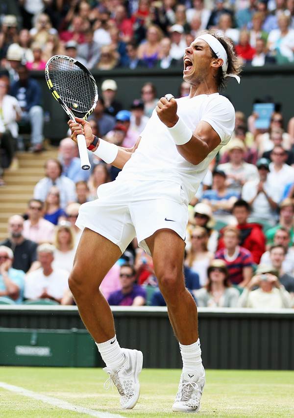 Rafael Nadal celebrates after beating Lukas Rosol of the Czech Republic