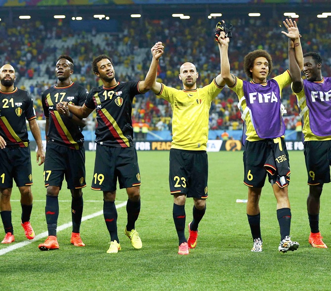 The Belgium team celebrate after their 2014 World Cup Group H soccer match against South Korea at the Corinthians arena in Sao Paulo