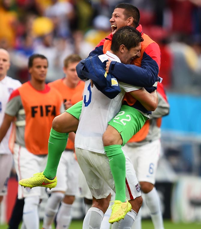 Omar Gonzalez (L) and Nick Rimando of the United States celebrate after the match