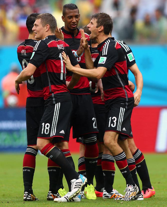 Germany's players celebrate after Thomas Mueller (right) scored the goal.