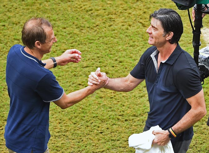 Head coaches Jurgen Klinsmann of the United States (left) and Joachim Loew of Germany shake hands after the match