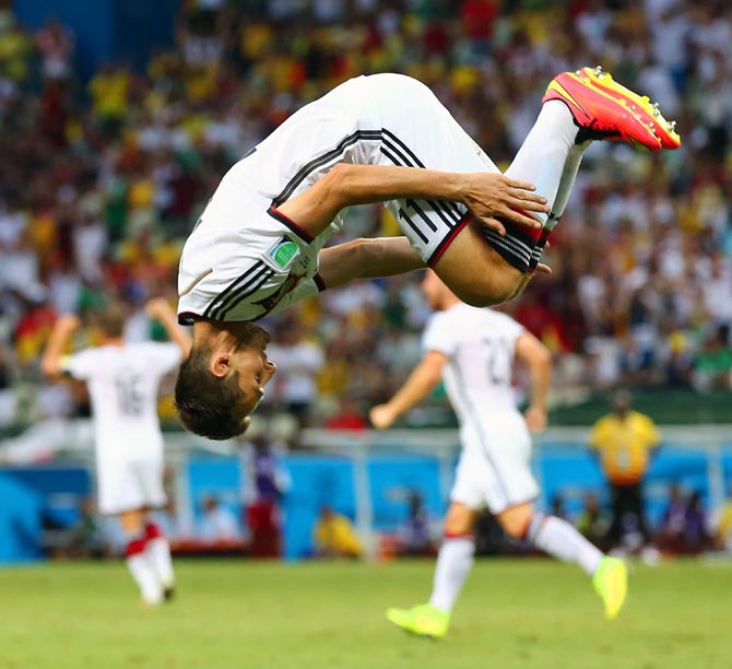Miroslav Klose of Germany does a flip in celebration of scoring his team's second goal against Ghana