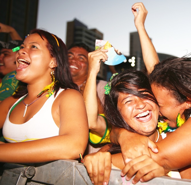 Fans cheer after Brazil scored a goal