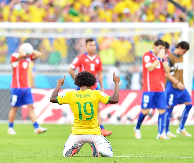 Willian of Brazil celebrates after defeating Chile in a penalty shootout