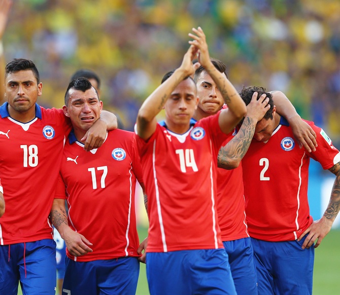 From left, Gonzalo Jara, Gary Medell, Fabian Orellana, Eduardo Vargas and Eugenio Mena of Chile react after being defeated by Brazil