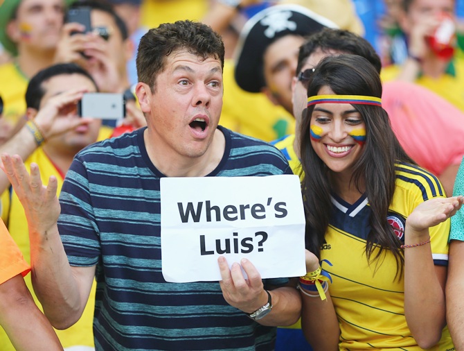 Colombian fans hold up a sign 'Where's Luis' in reference to the banned Luis Suarez