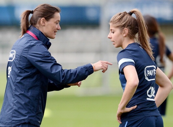 French women's national football team coach Corinne Diacre, left