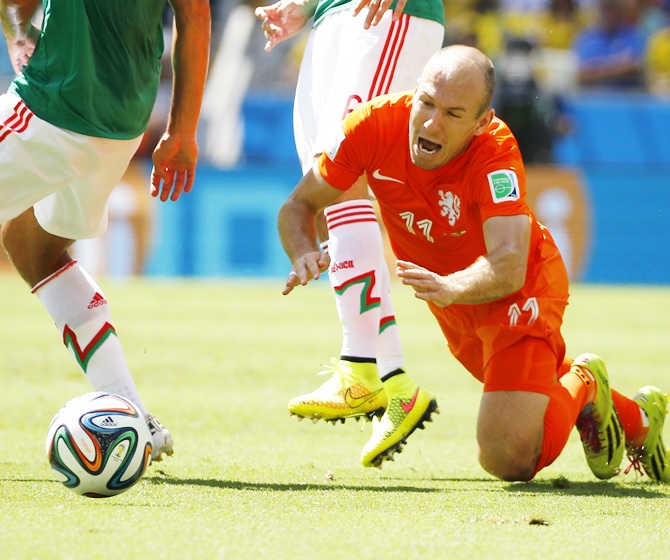 Arjen Robben of the Netherlands reacts after being fouled