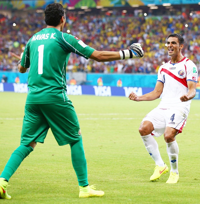 Keylor Navas, left, and Michael Umana of Costa Rica celebrate after defeating Greece in a penalty shootout