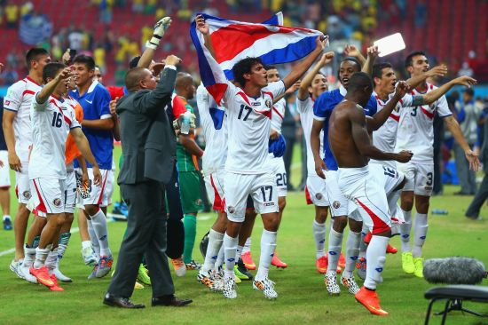 Yeltsin Tejeda of Costa Rica celebrates with teammates defeating Greece in a penalty shootout