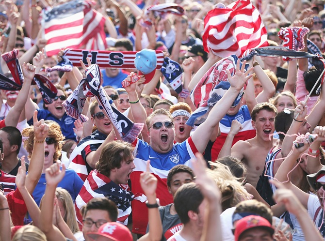 Fans in Grant Park celebrate a goal by the US against Portugal in a Group G   World Cup soccer match on June 22, 2014 in Chicago, Illinois. Fans were turned   away from the free event after a 10,000-person capacity was reached.