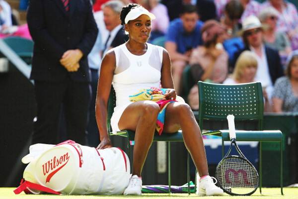 Venus Williams of the United States takes a break during a change of ends in her third round match against Petra Kvitova of Czech Republic