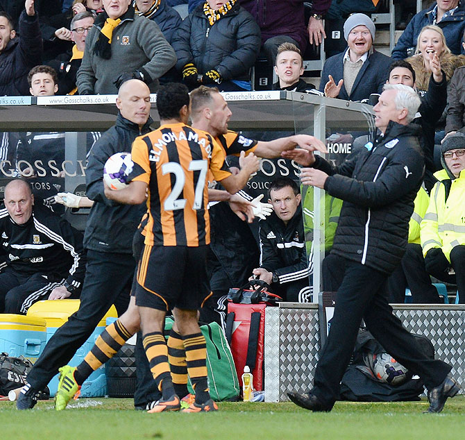  David Meyler of Hull City pushes Alan Pardew, manager of Newcastle United during the Barclays Premier League match