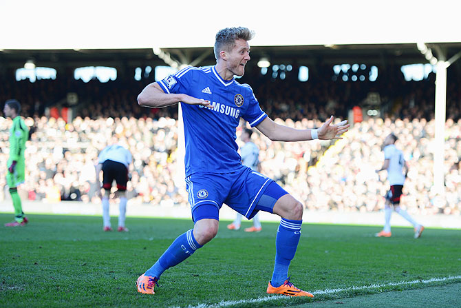 Andre Schurrle of Chelsea celebrates as he scoring against Fulham on Saturday